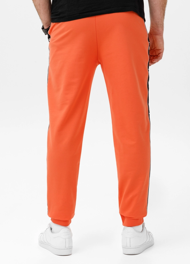 Spodnie męskie dresowe Pitbull Pit Bull Tape Nugget łososiowe pomarańczowe